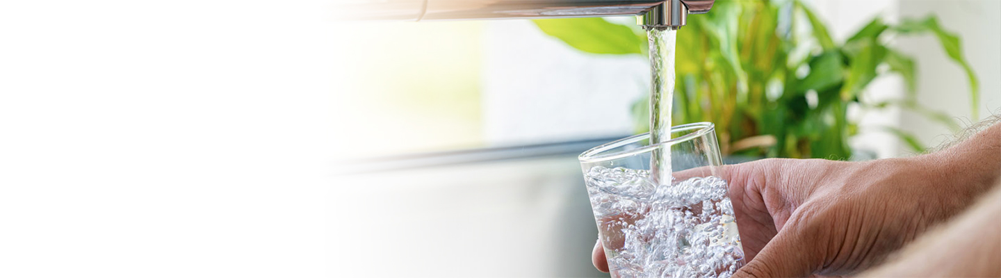 filling water under faucet