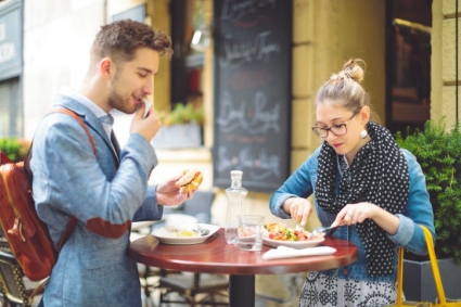 Young couple shopping in a coffee shop; E+ 1006642252
