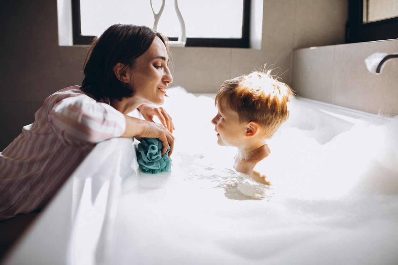 Mother washing little son in bathroom; Shutterstock ID 1775522225; purchase_order: Cathy Stidwell - Brand Enterprise photos; job: 